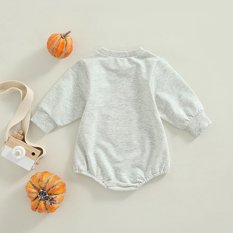 Back view of gray pumpkin romper