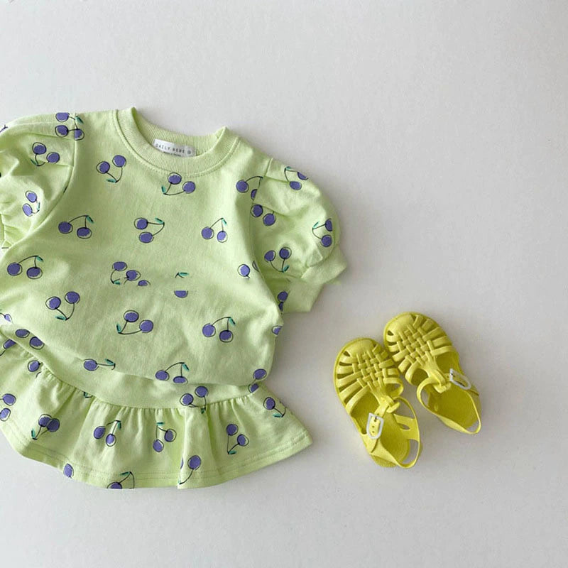 Green cherry print top and skirt with sandals