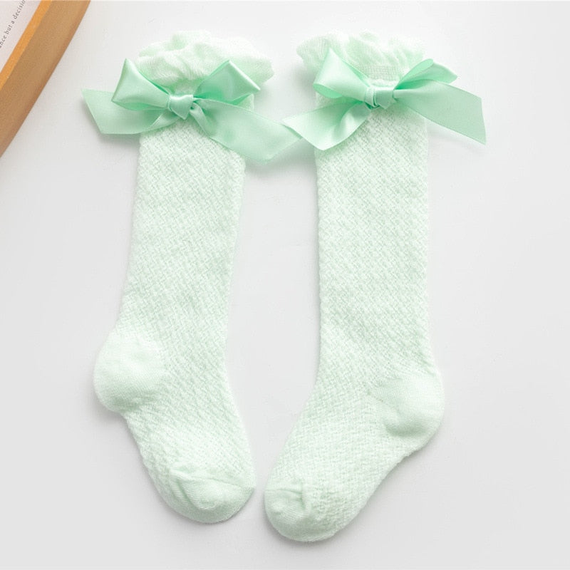 Mint green openwork knee socks with bows