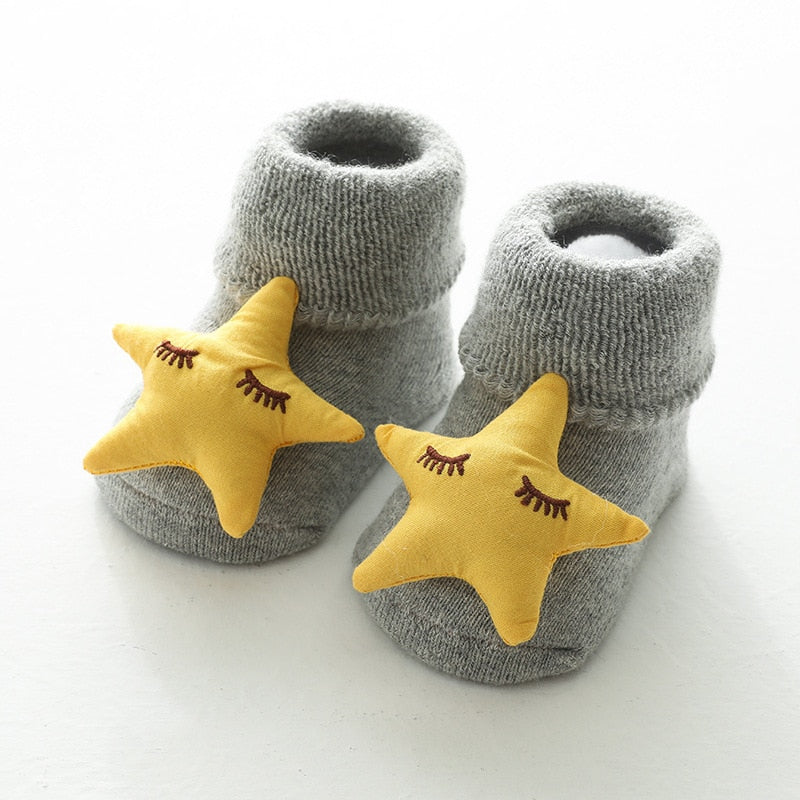 Grey thick baby socks with yellow star toppers