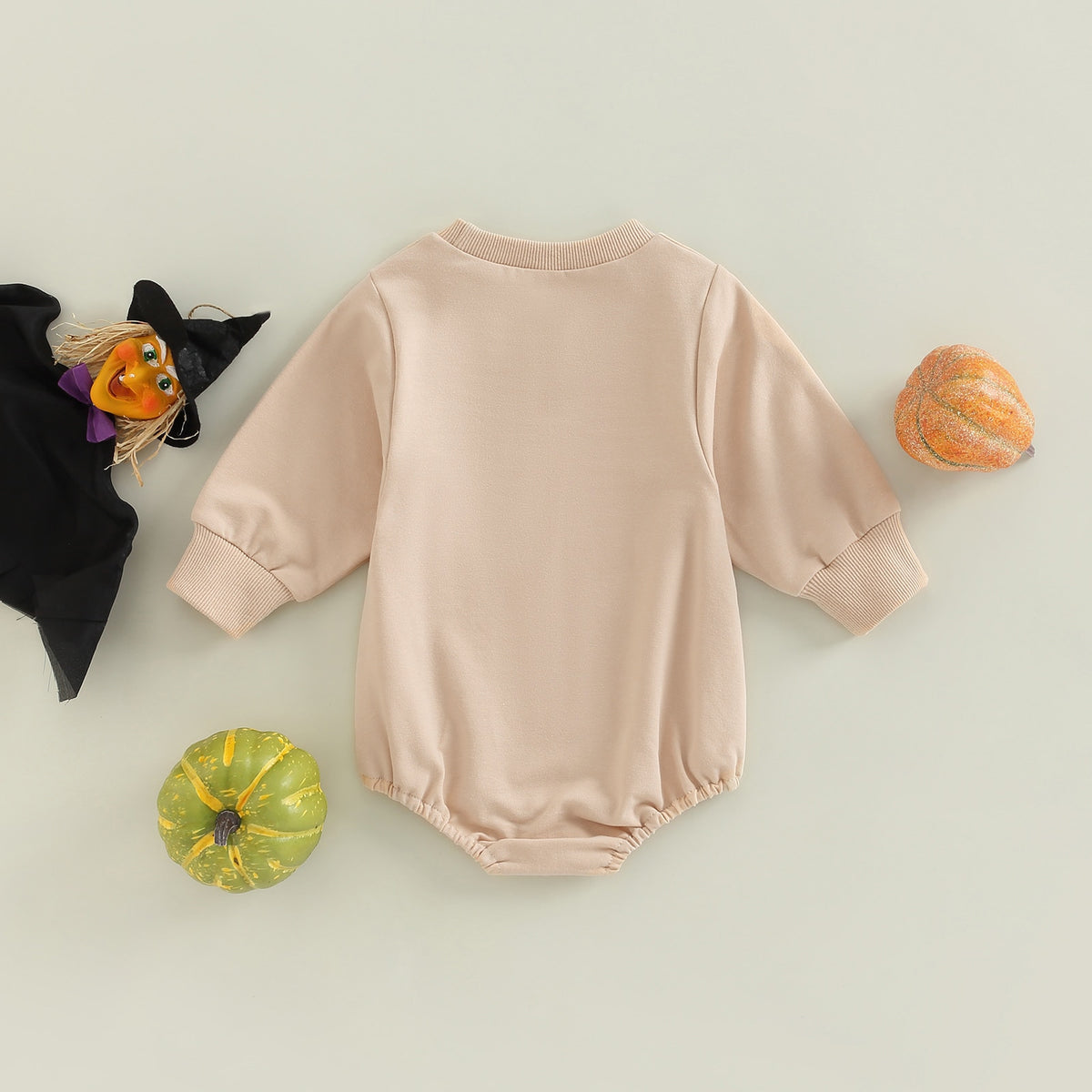 Back view of beige Halloween baby romper