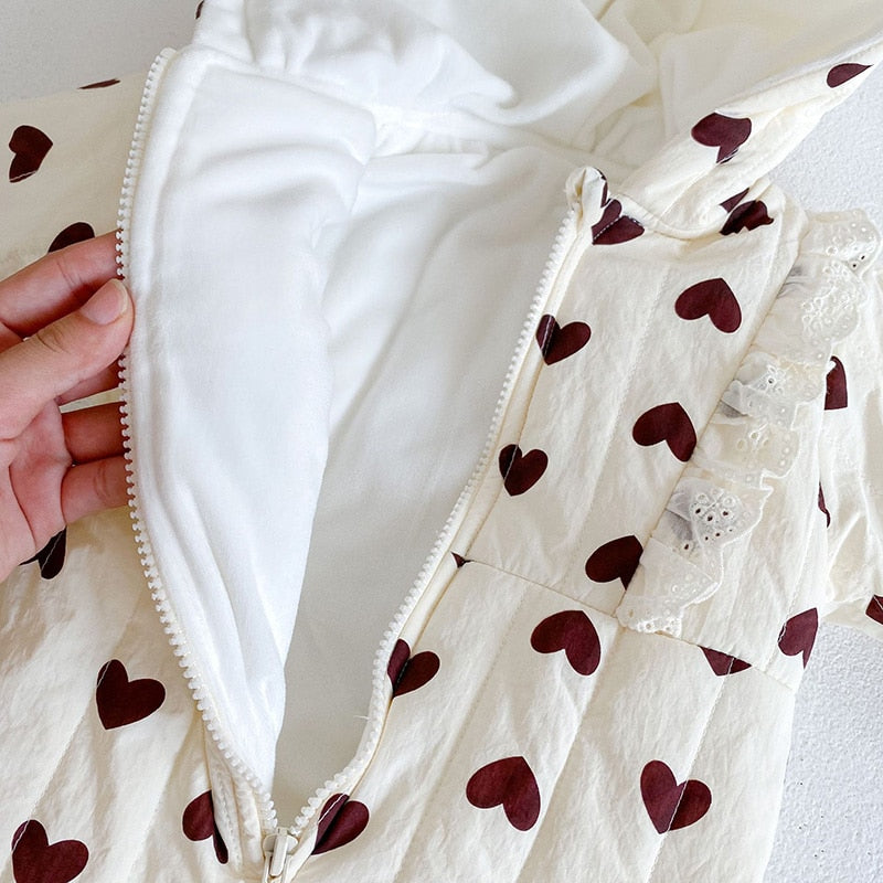 Heart romper opened to show fleece lining