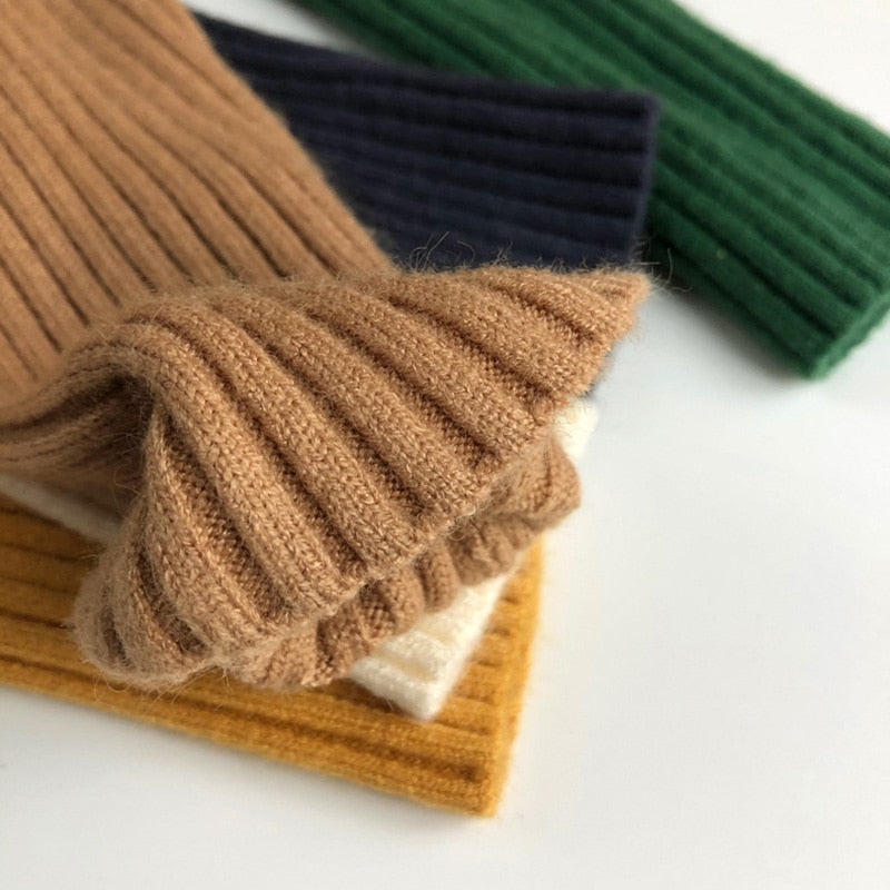 Ribbed cuff detail on kids turtleneck sweater