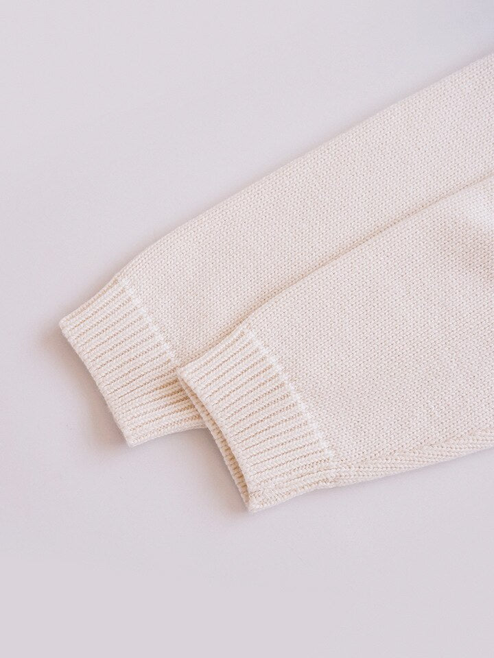 Close-up of ribbed cuffs on beige pullover