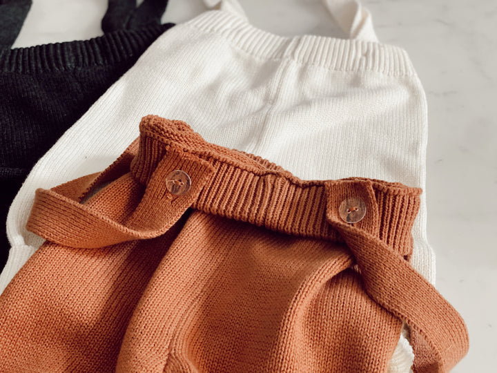 Close-up of knitted overall straps
