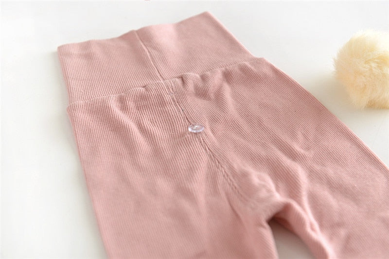 Close-up of high waistband on pink leggings