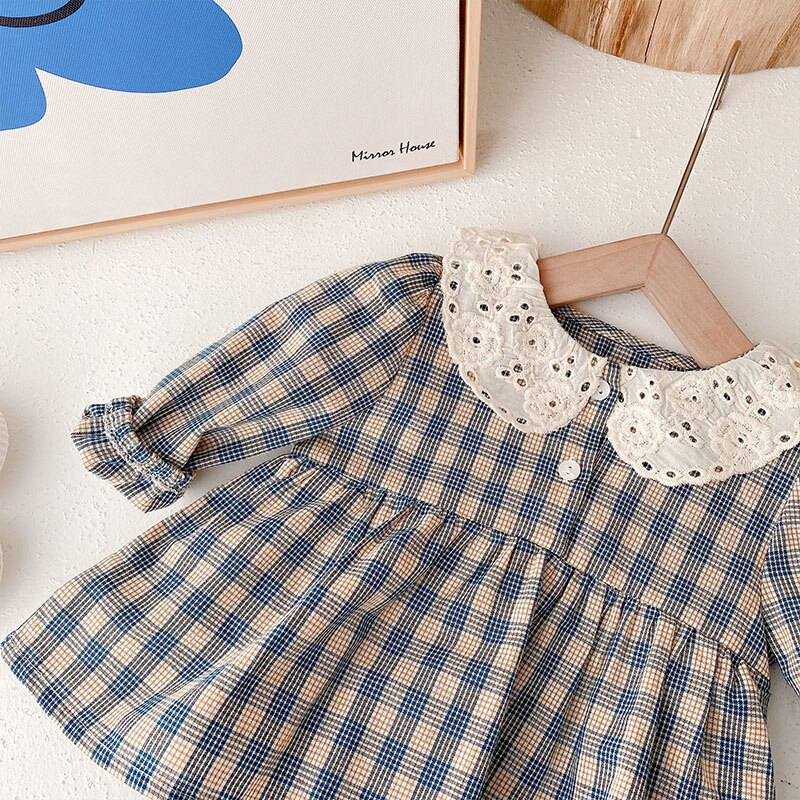 Close-up of plaid dress skirt and collar
