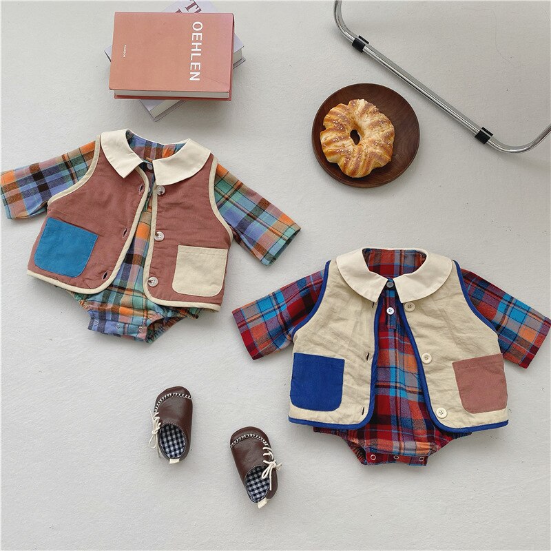 Plaid rompers and fleece vests laid flat with shoes