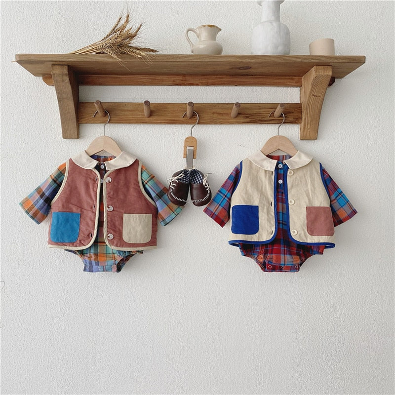 Plaid romper and vest sets hanging on hooks