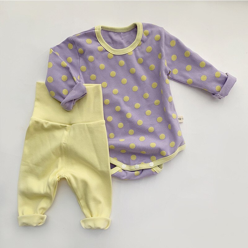 Purple polka dot bodysuit with yellow leggings