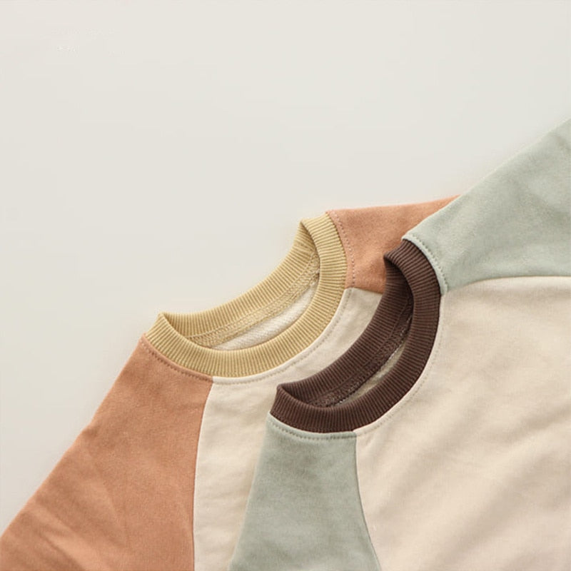 Close-up of contrast neckline on cotton romper