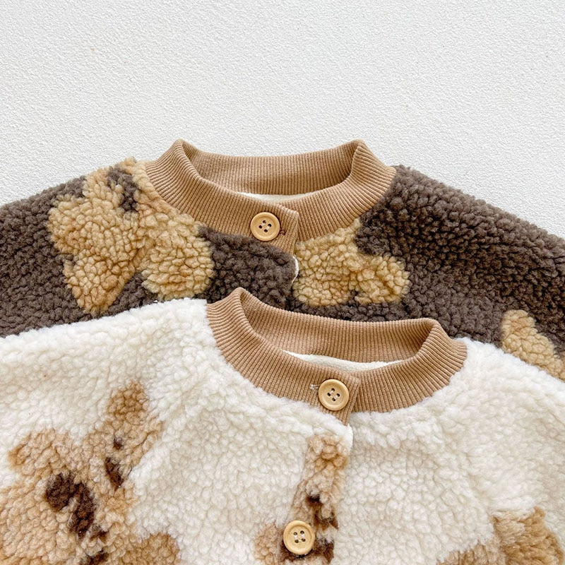 Close-up of buttons on sherpa rompers