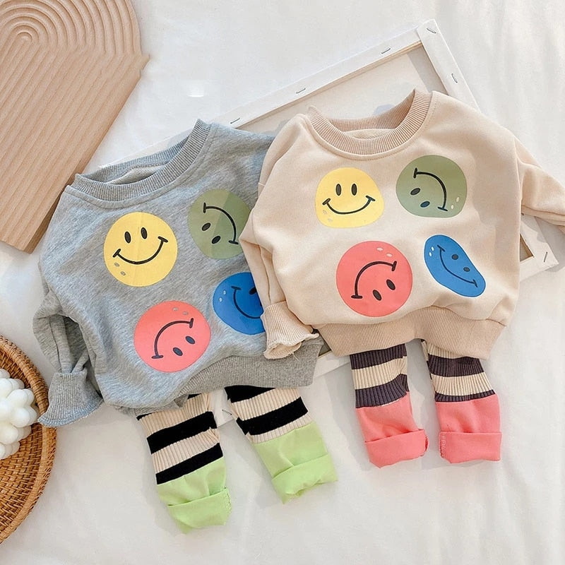 Grey and beige smiley face sweatshirt sets with striped leggings