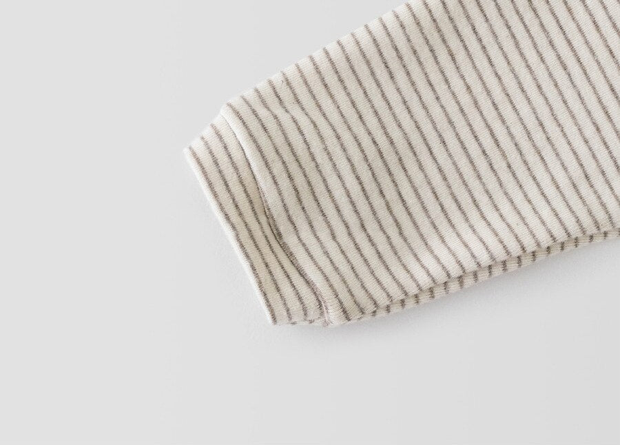 Close-up of sleeve cuff on striped top