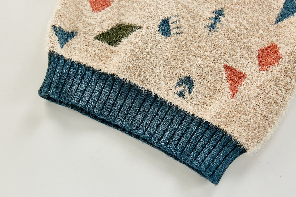 Close-up of teal ribbed hem on geometric sweater