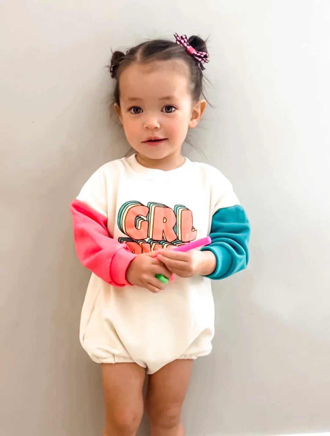 Toddler wearing GRL PWR colour block romper