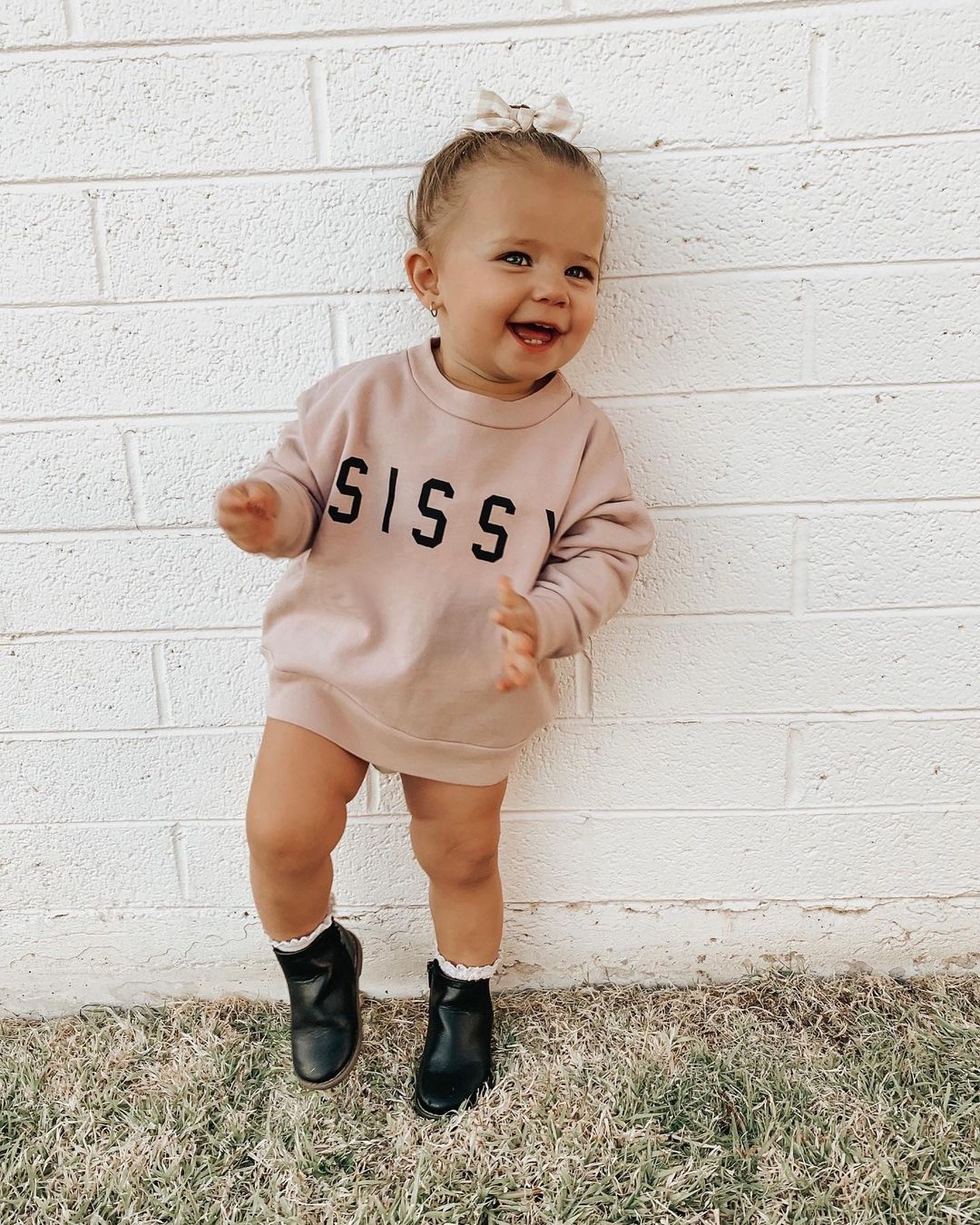 Toddler wearing pink SISSY sweatshirt