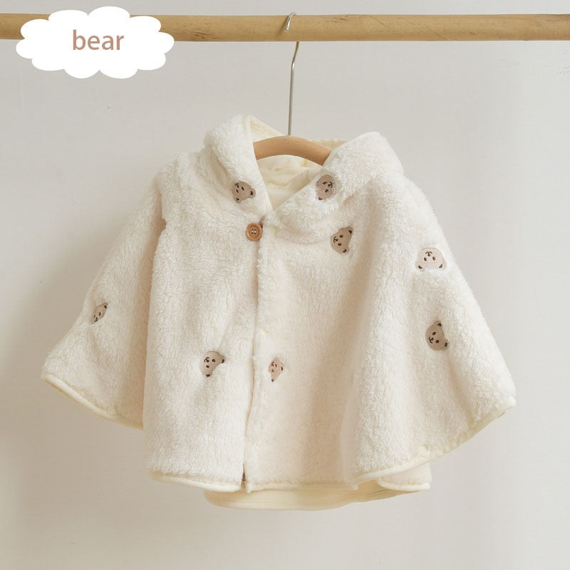 Tulip bunny embroidered cape on a hanger