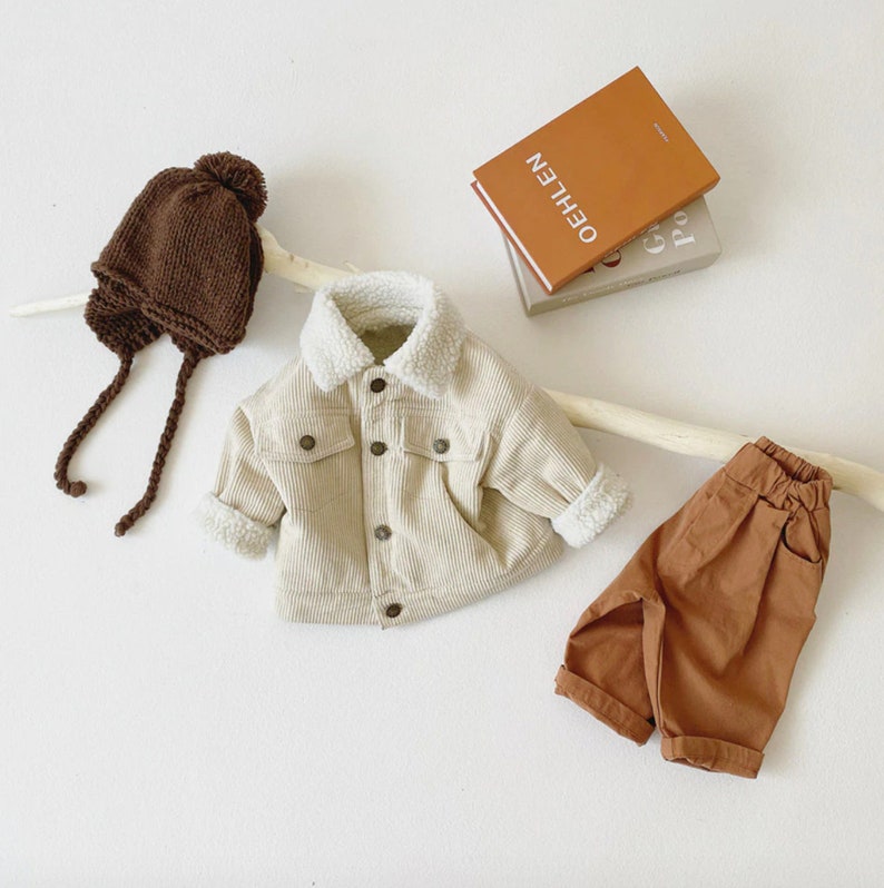 White corduroy toddler jacket styled with hat and pants