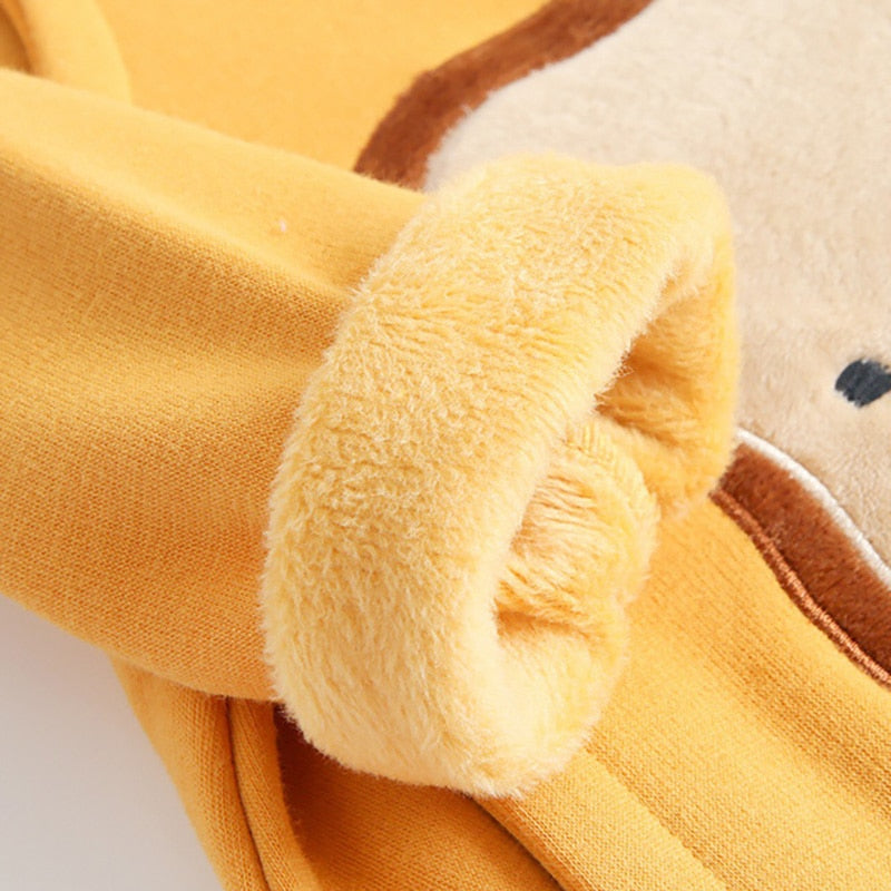 Close-up of plush fleece cuff on yellow jumpsuit