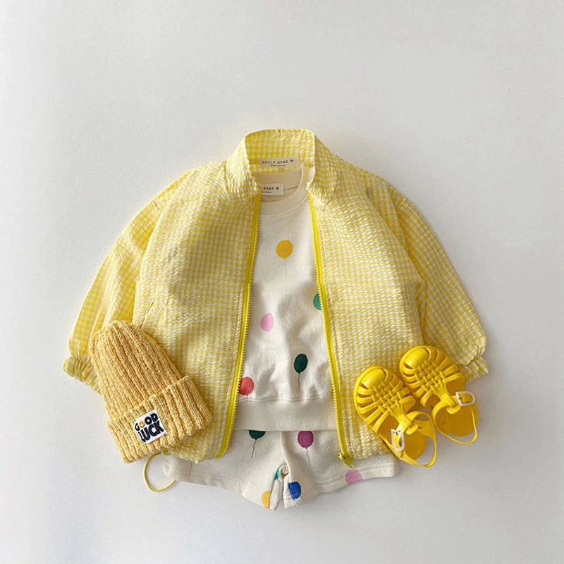 Yellow gingham zip sun jacket styled with hat and sandals
