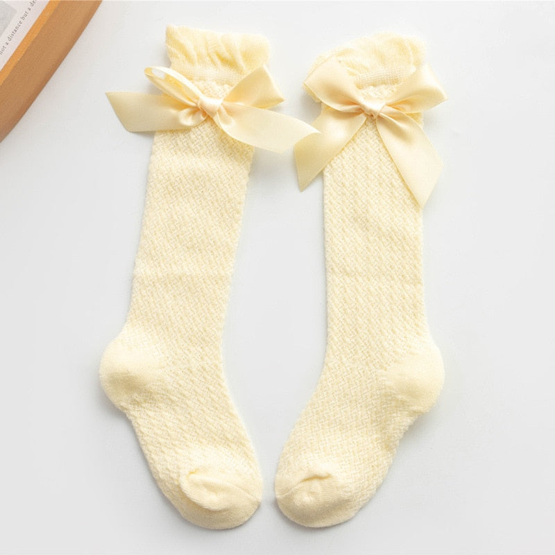 Yellow openwork knee socks with satin bows